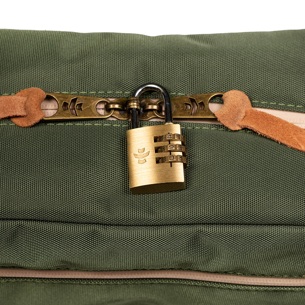 Green bag with a brass padlock on a white background