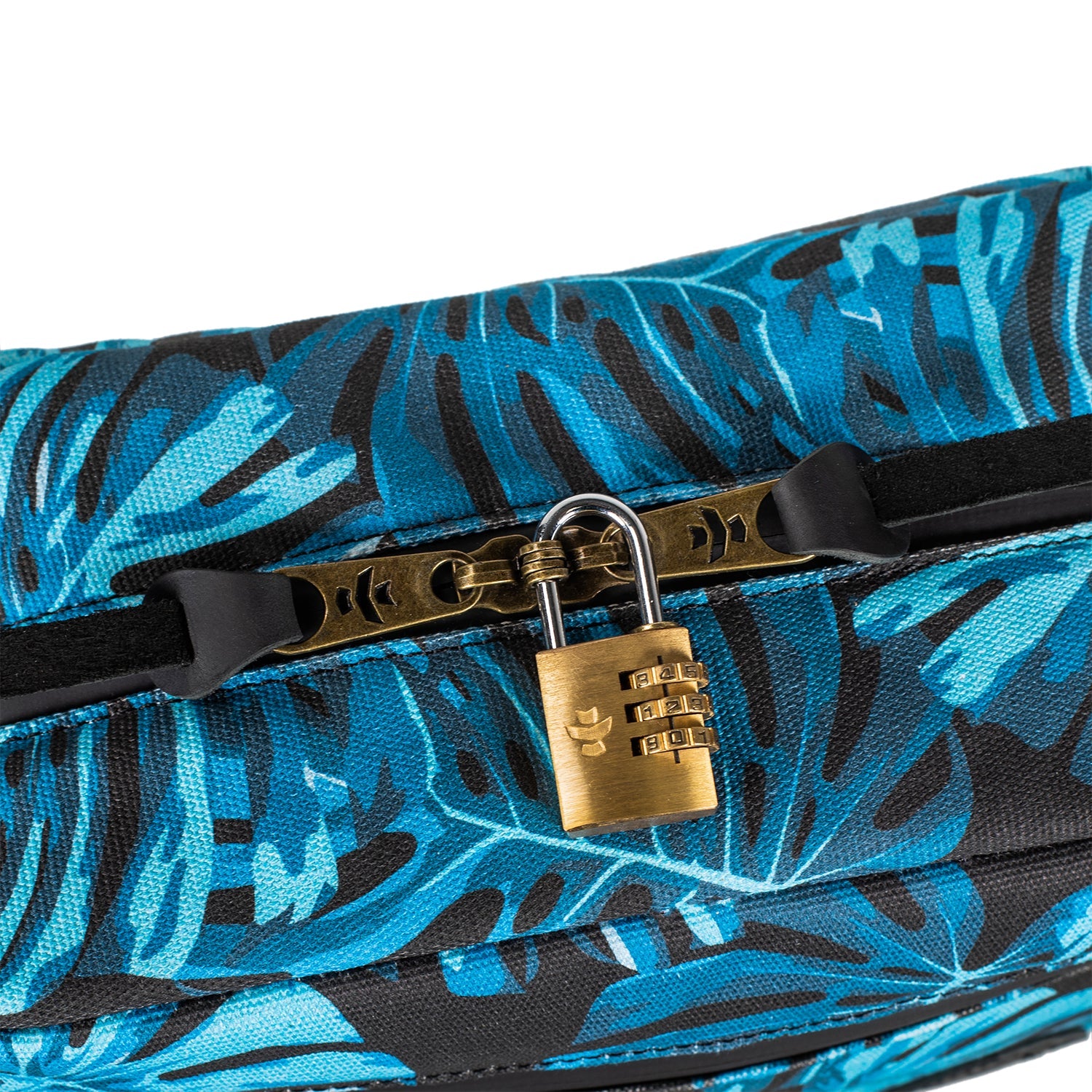 Blue floral-patterned suitcase with a gold combination lock on a white background