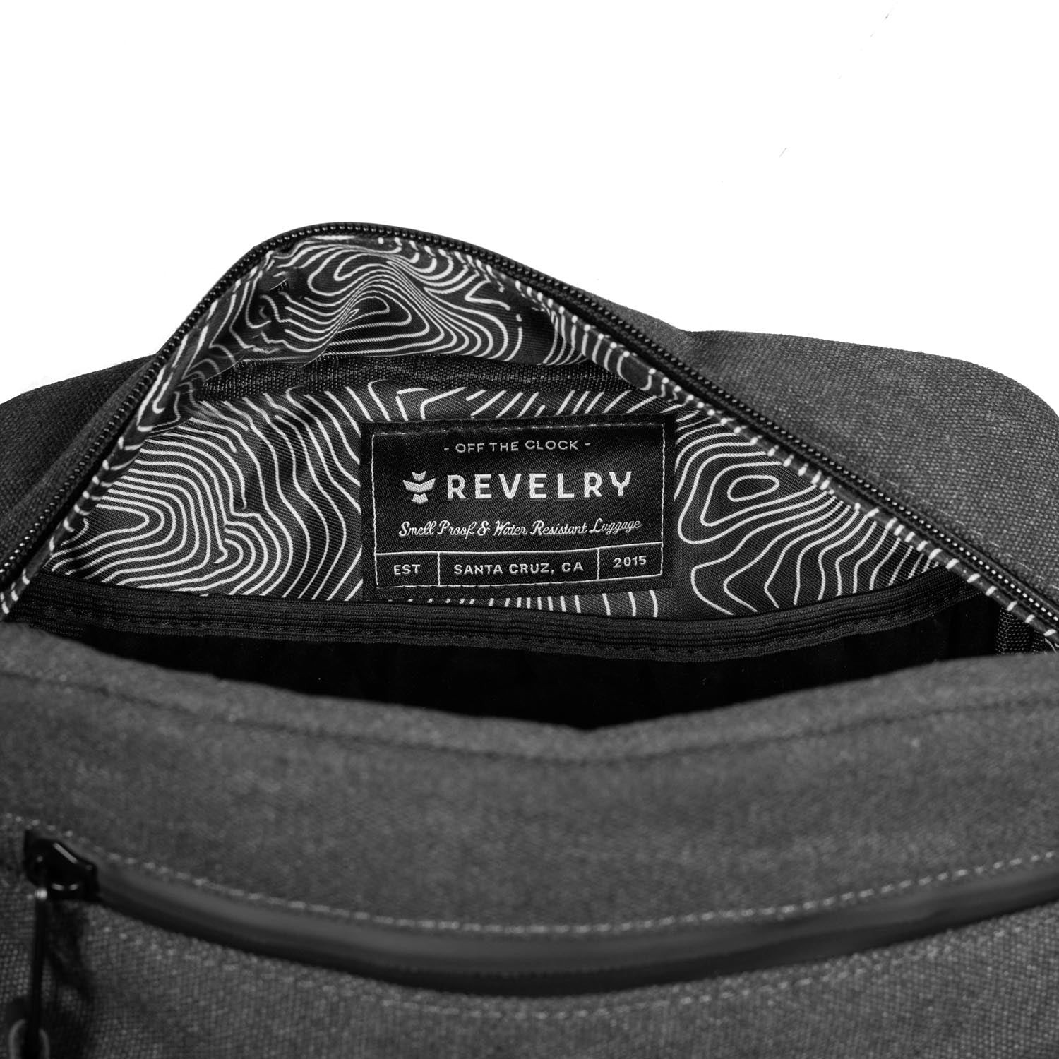 Gray bag with a patterned interior and Revelry logo on a white background