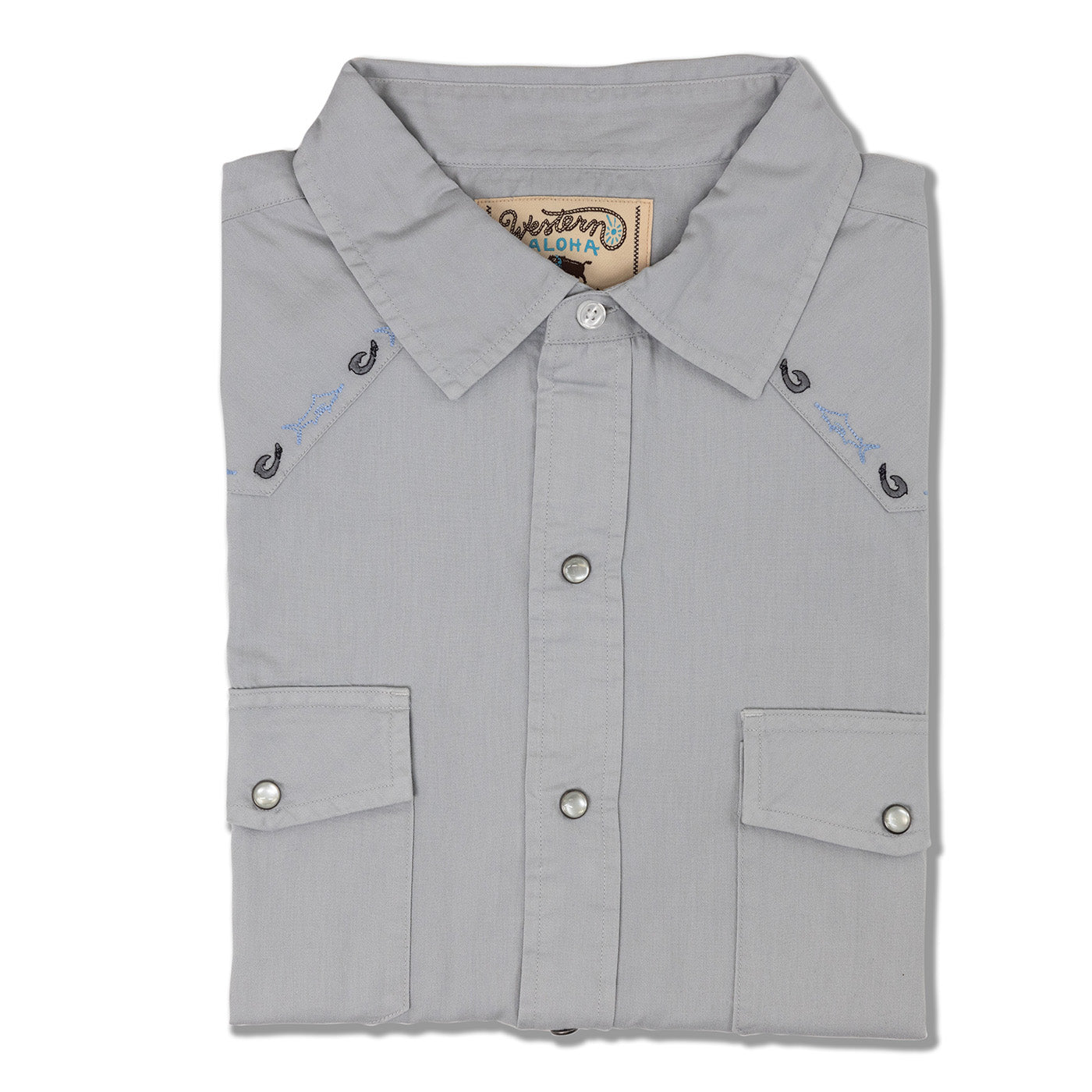 Folded gray shirt with button details on a white background