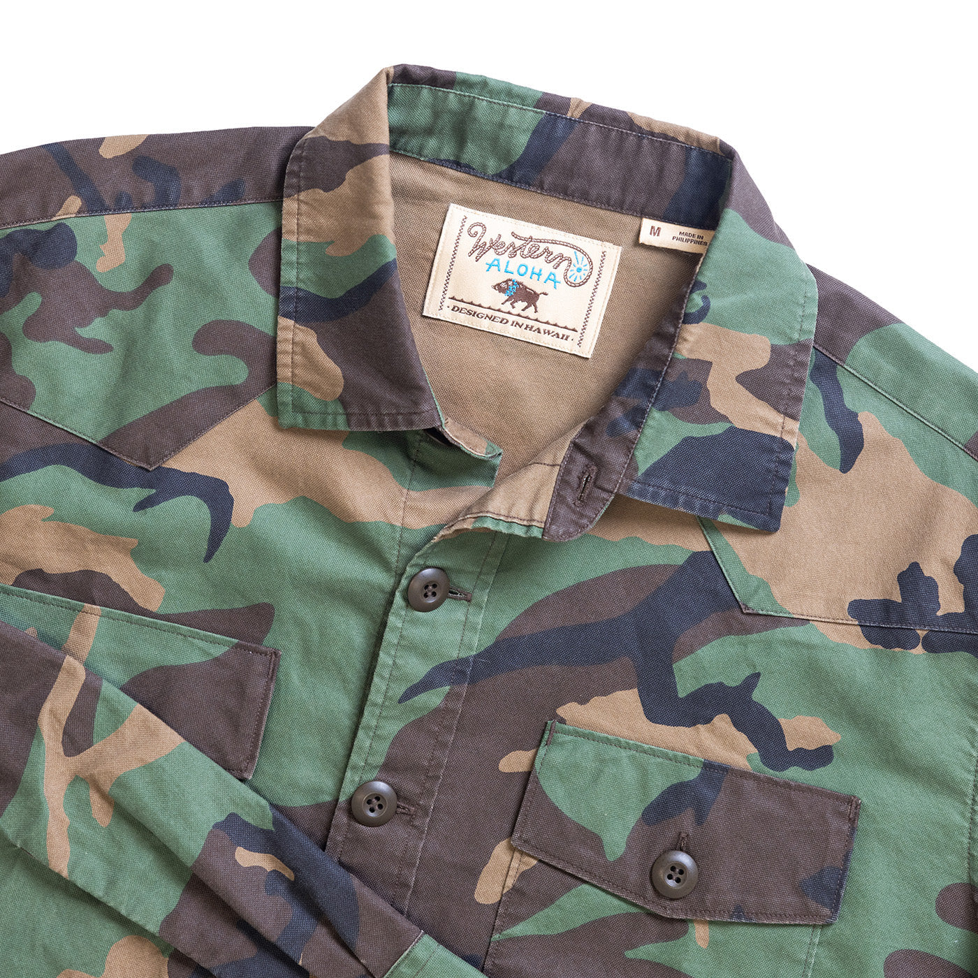 Camouflage shirt with a visible brand label on a white background
