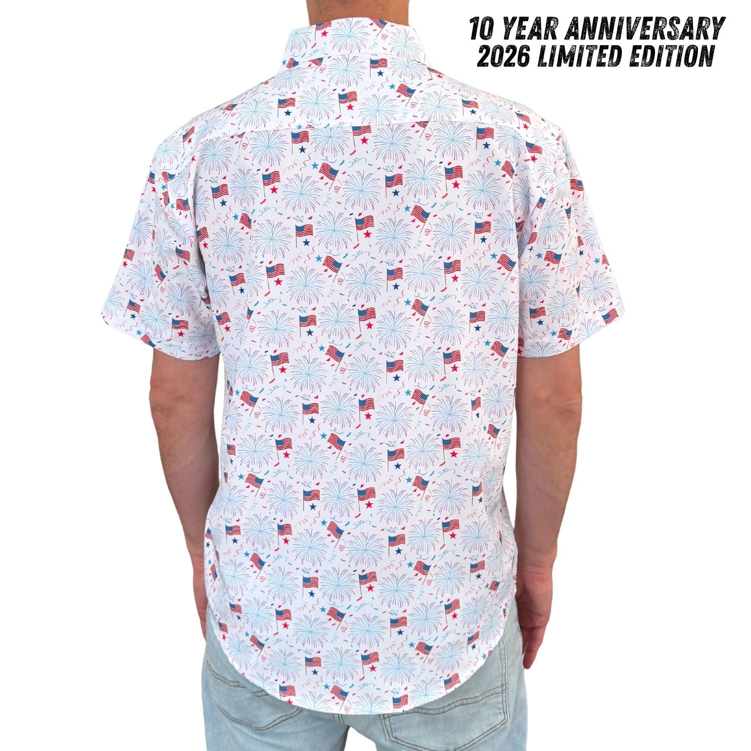 Short-sleeve shirt with a pattern of small American flags on a white background, labeled '10 Year Anniversary 2026 Limited Edition'.