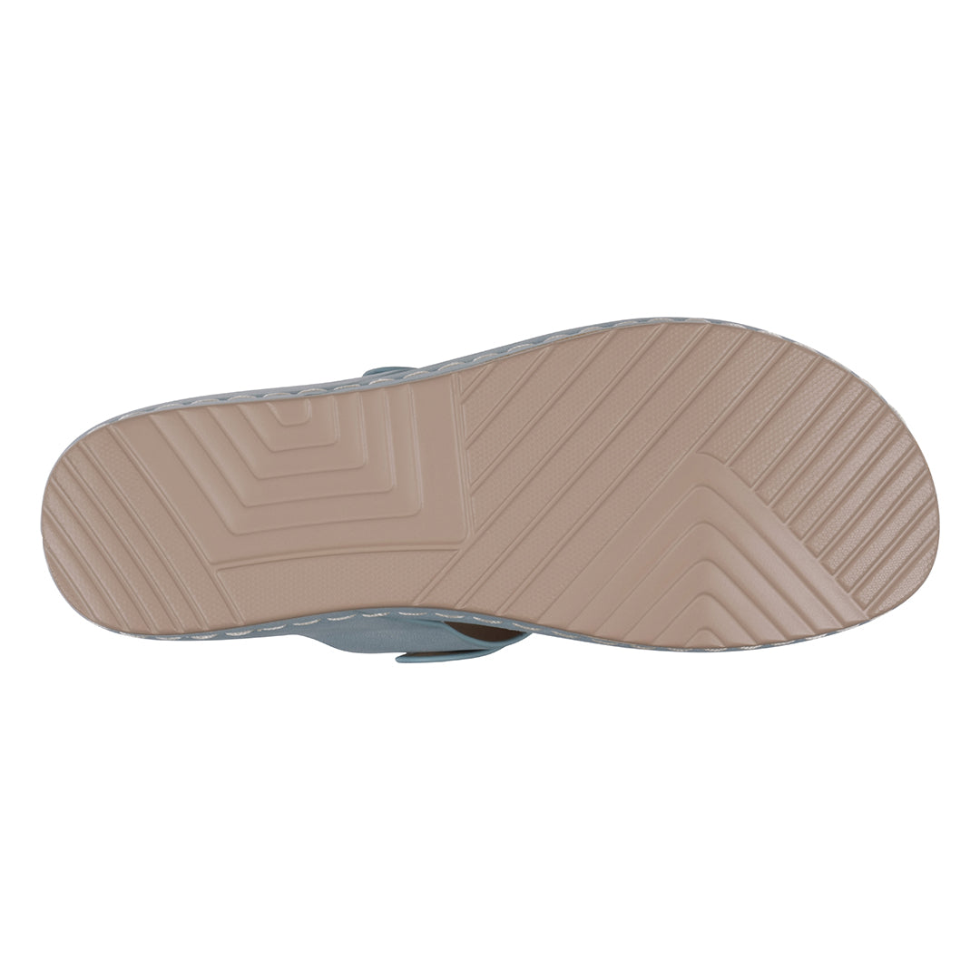 Close-up of a sandal sole with textured pattern on a white background