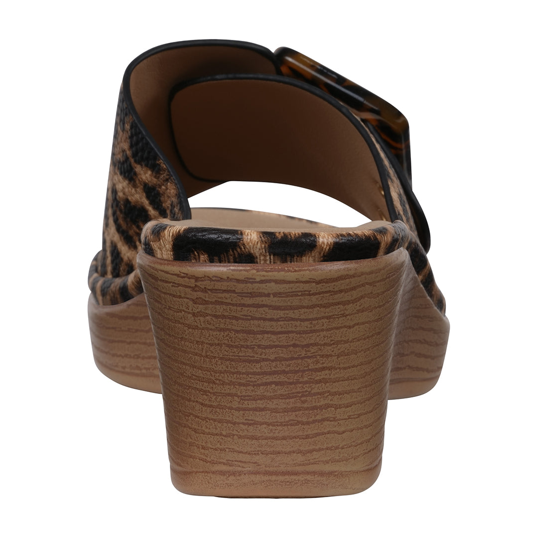 Leopard print sandal with wooden sole on a white background