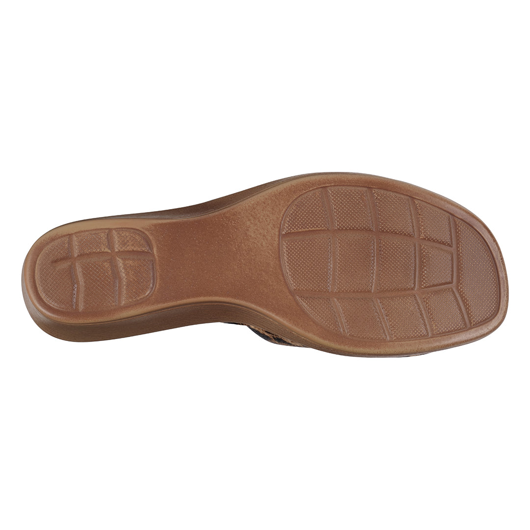 Brown shoe sole with tread pattern on a white background