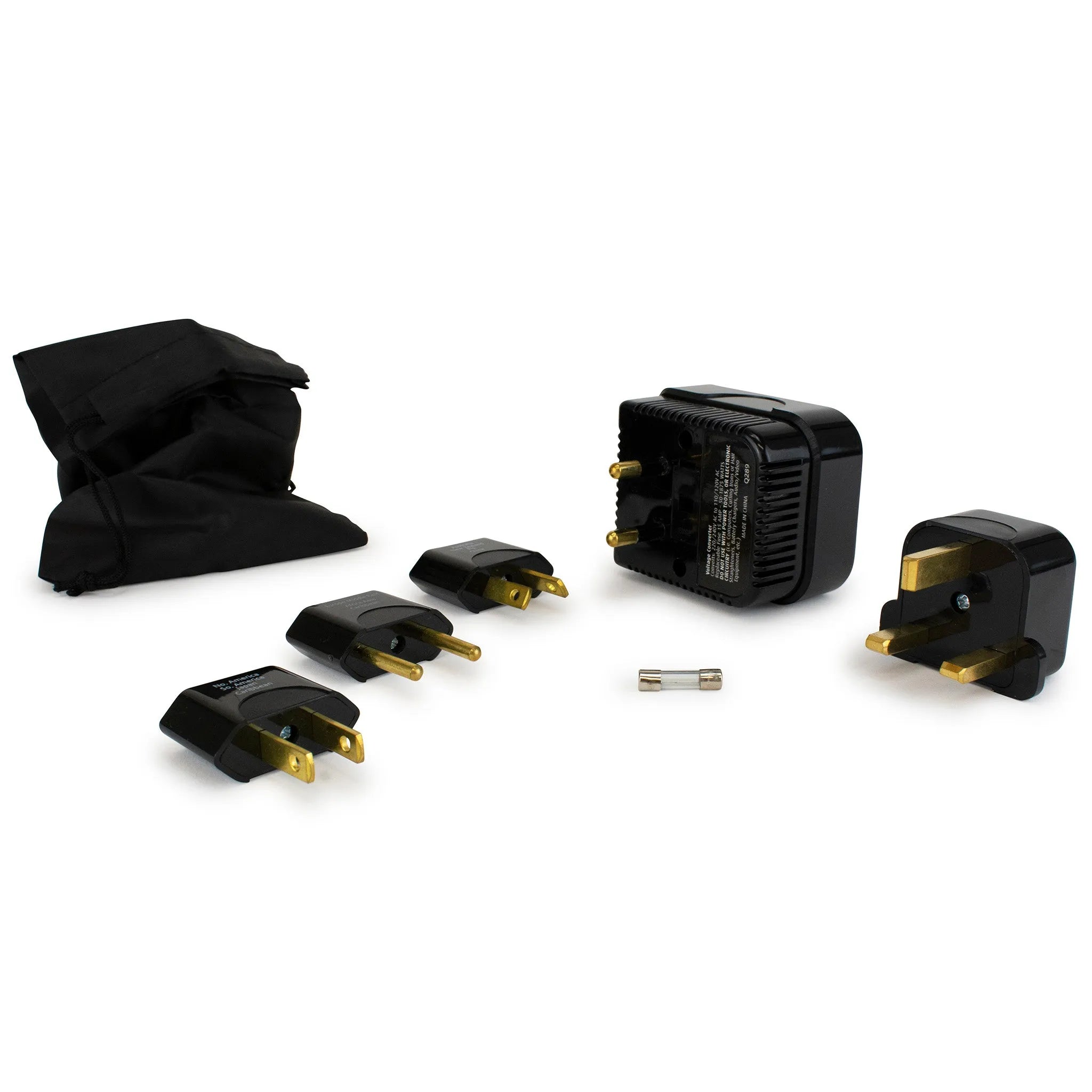 Set of black travel adapters with gold connectors on a white background