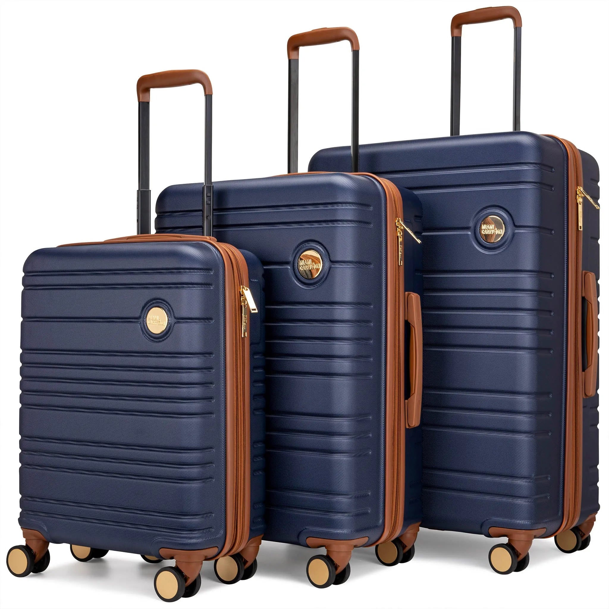 Set of three navy blue suitcases with brown handles and wheels on a white background