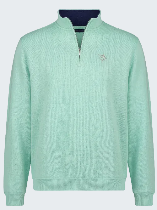 Light blue pullover with a small logo on a white background