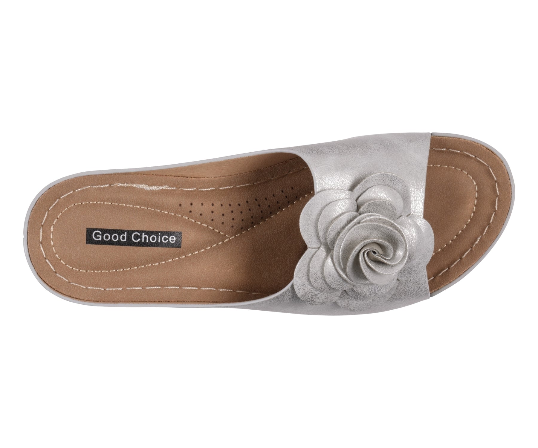 White sandal with a flower design on a brown sole, labeled 'Good Choice'.