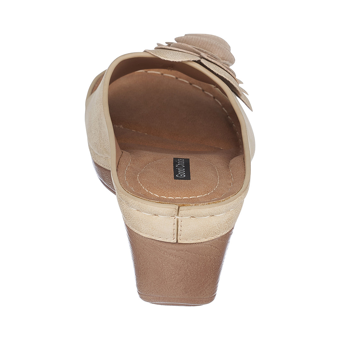 Beige sandal with wedge heel on a white background