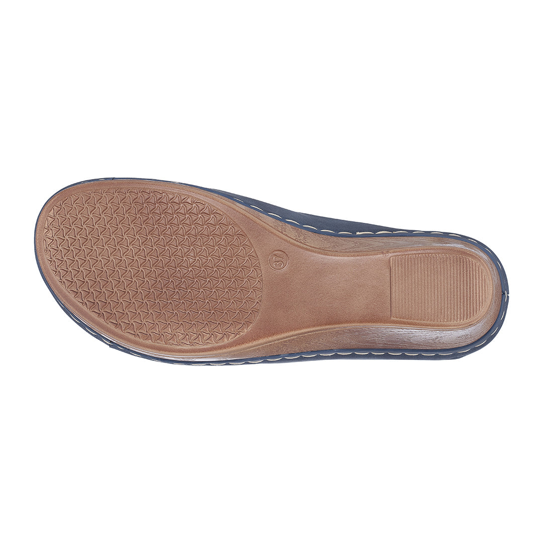 Brown shoe sole with tread pattern on a white background
