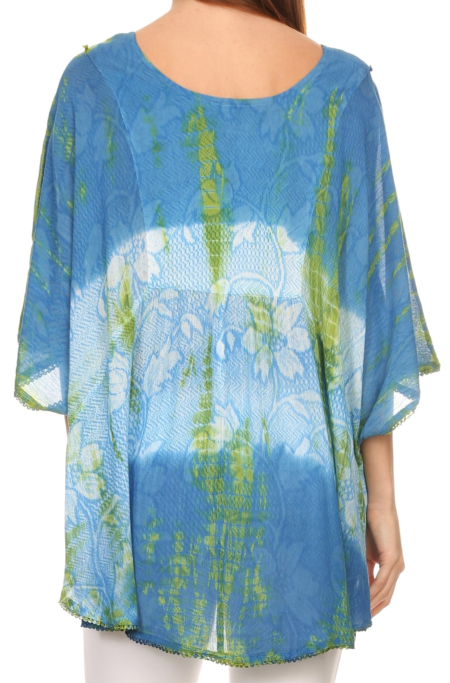 Blue floral patterned top worn by a person on a white background
