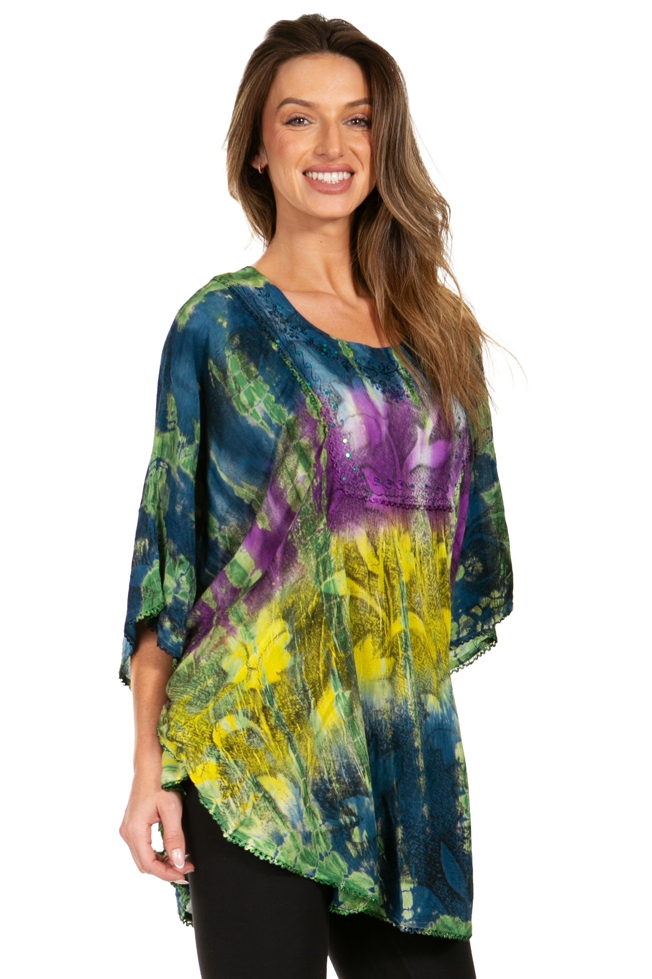 Woman wearing a colorful tie-dye shirt on a white background