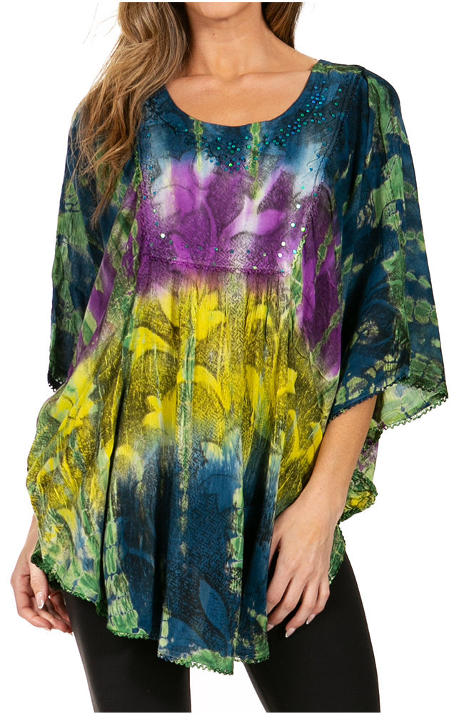 Woman wearing a colorful floral print top with a white background