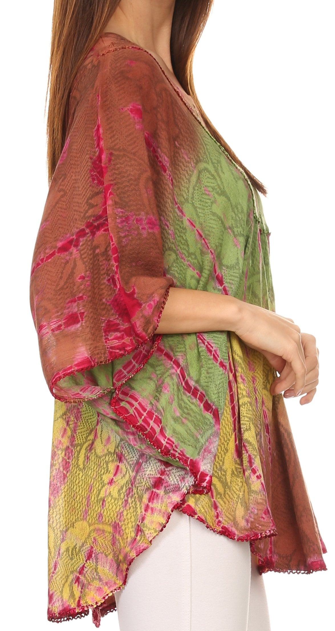 Woman wearing a colorful, patterned top with a white background