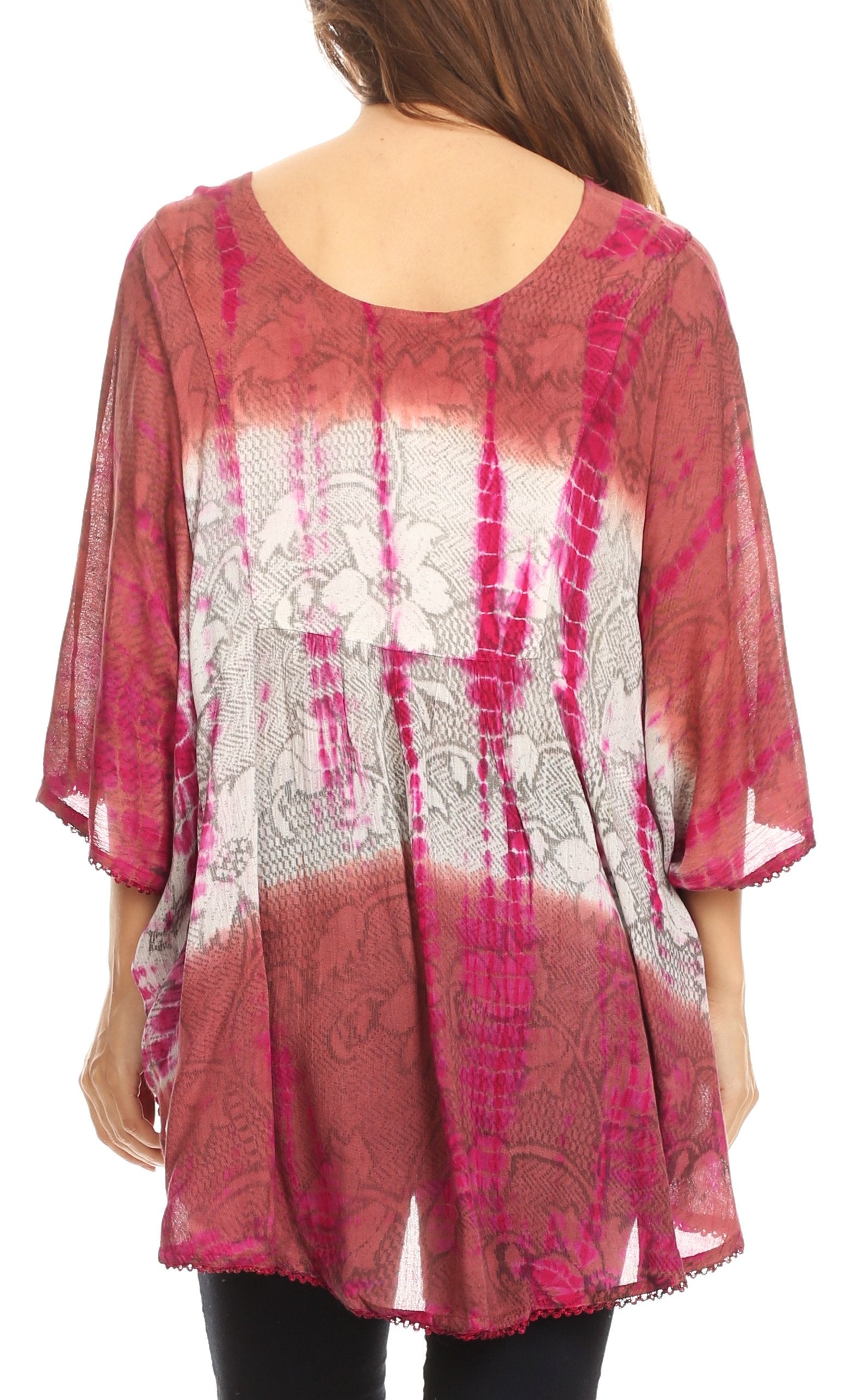 Woman wearing a pink and white tie-dye blouse with lace details on a white background
