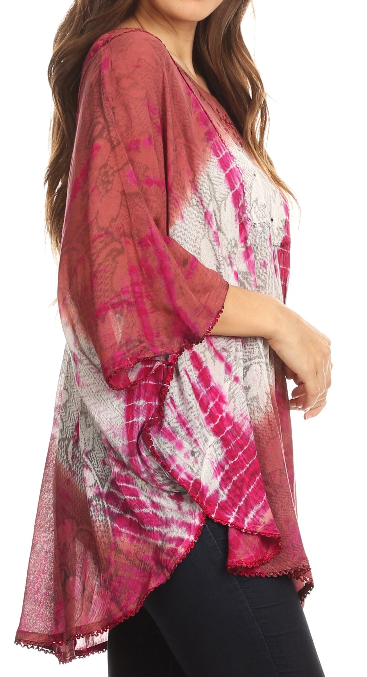 Woman wearing a pink and white patterned kimono-style top on a white background