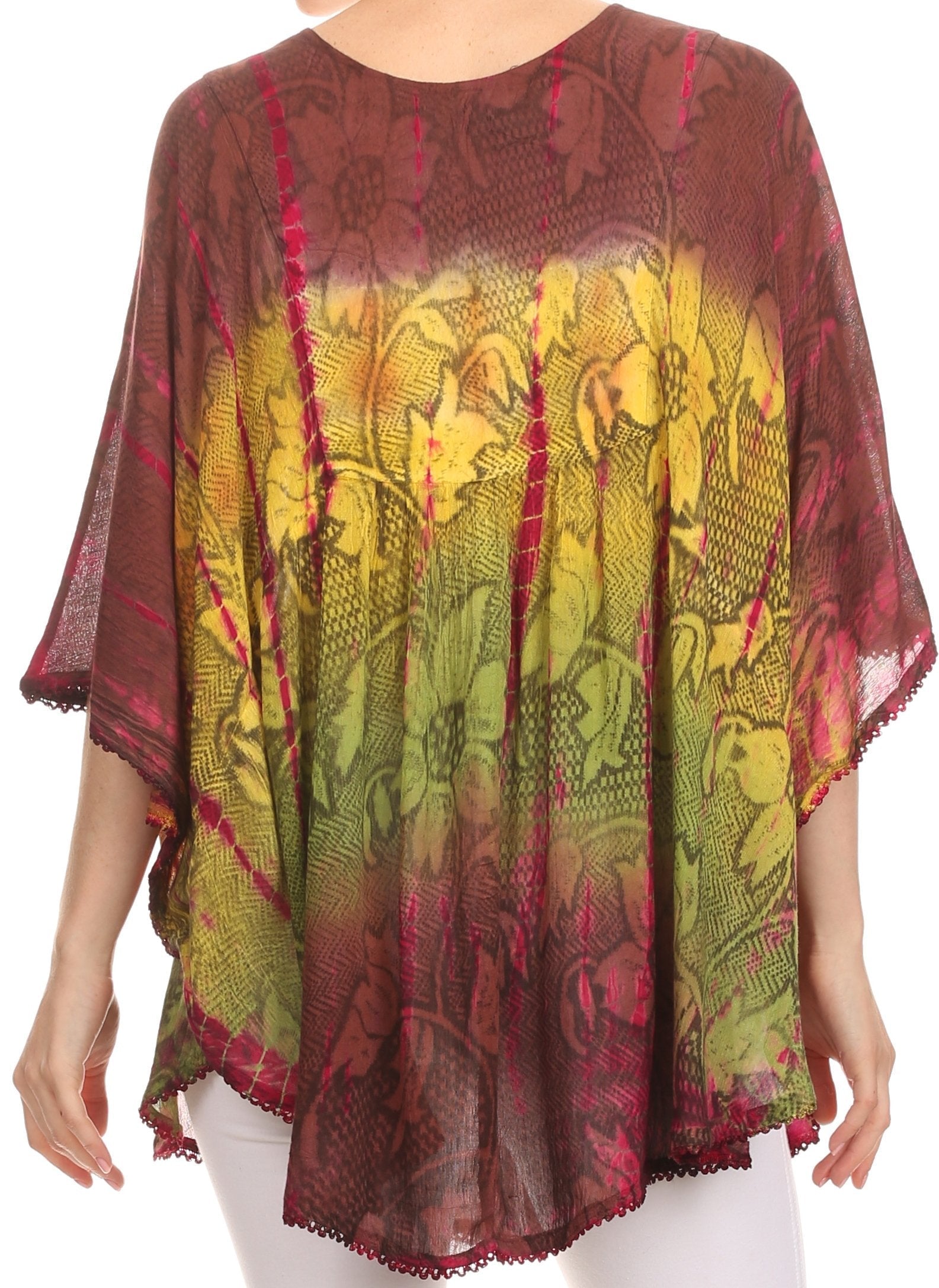 Colorful patterned top worn by a person on a white background