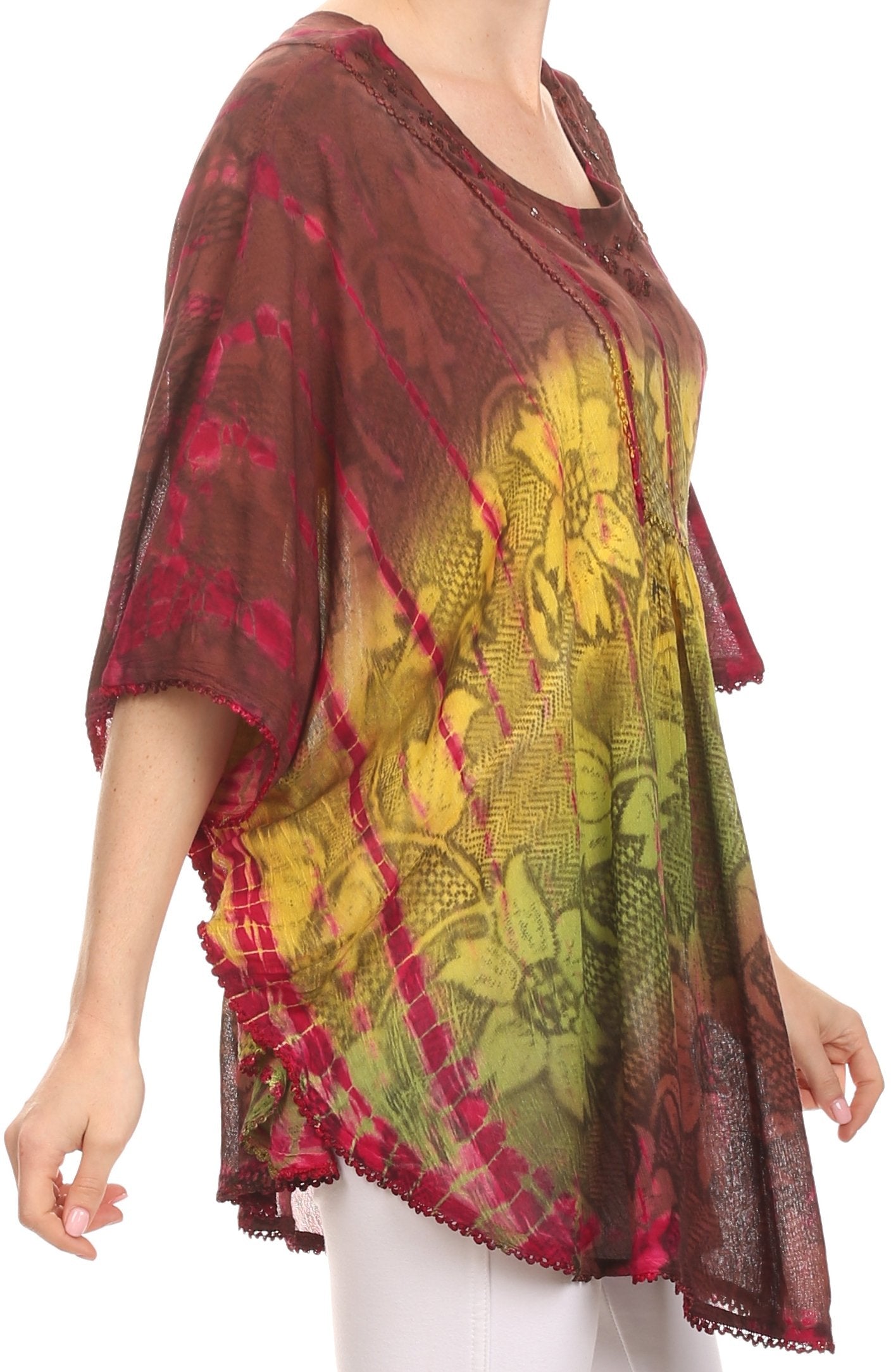 Woman wearing a colorful patterned top with a white background