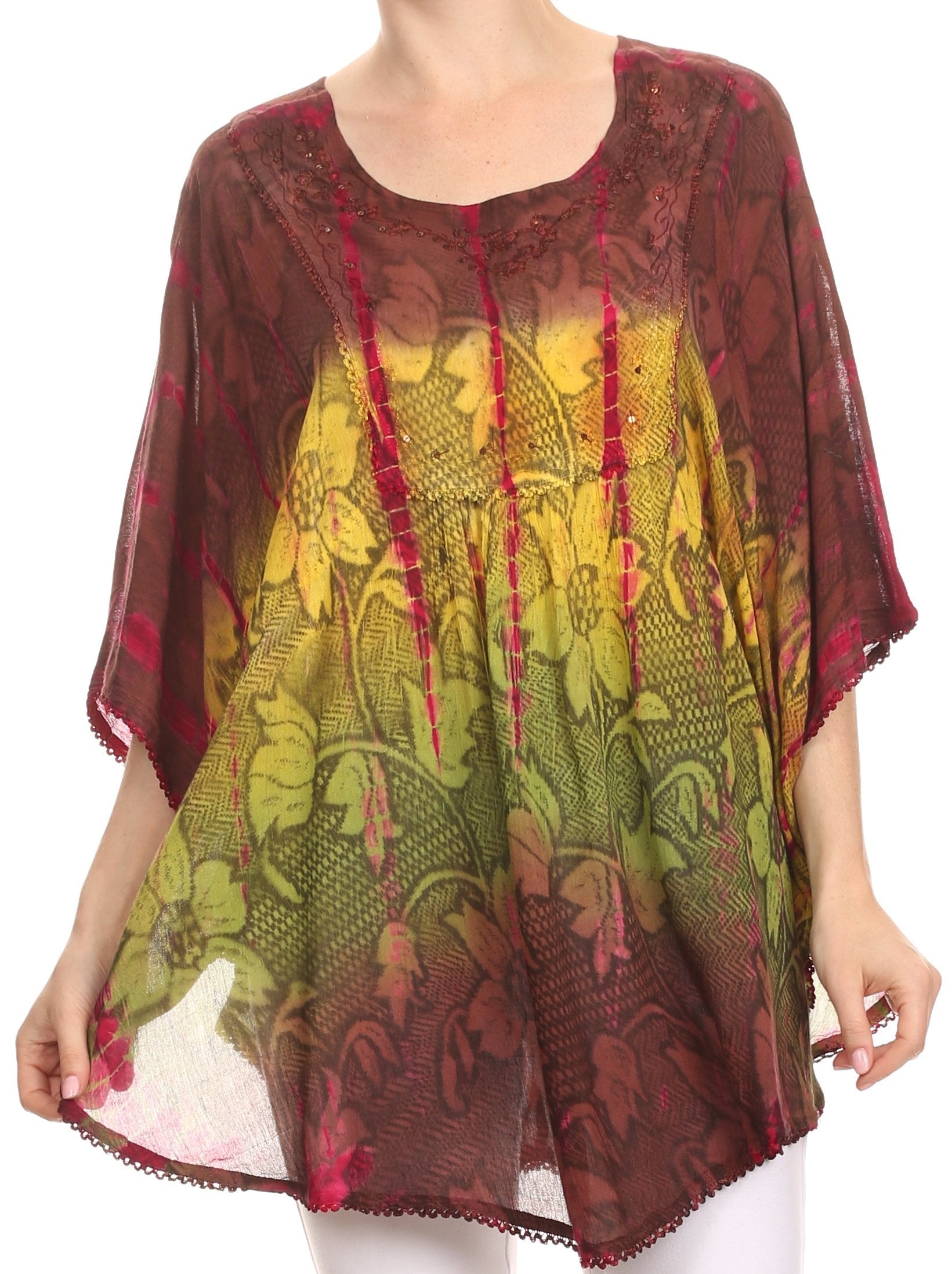 Woman wearing a patterned blouse with red, yellow, and green colors on a white background
