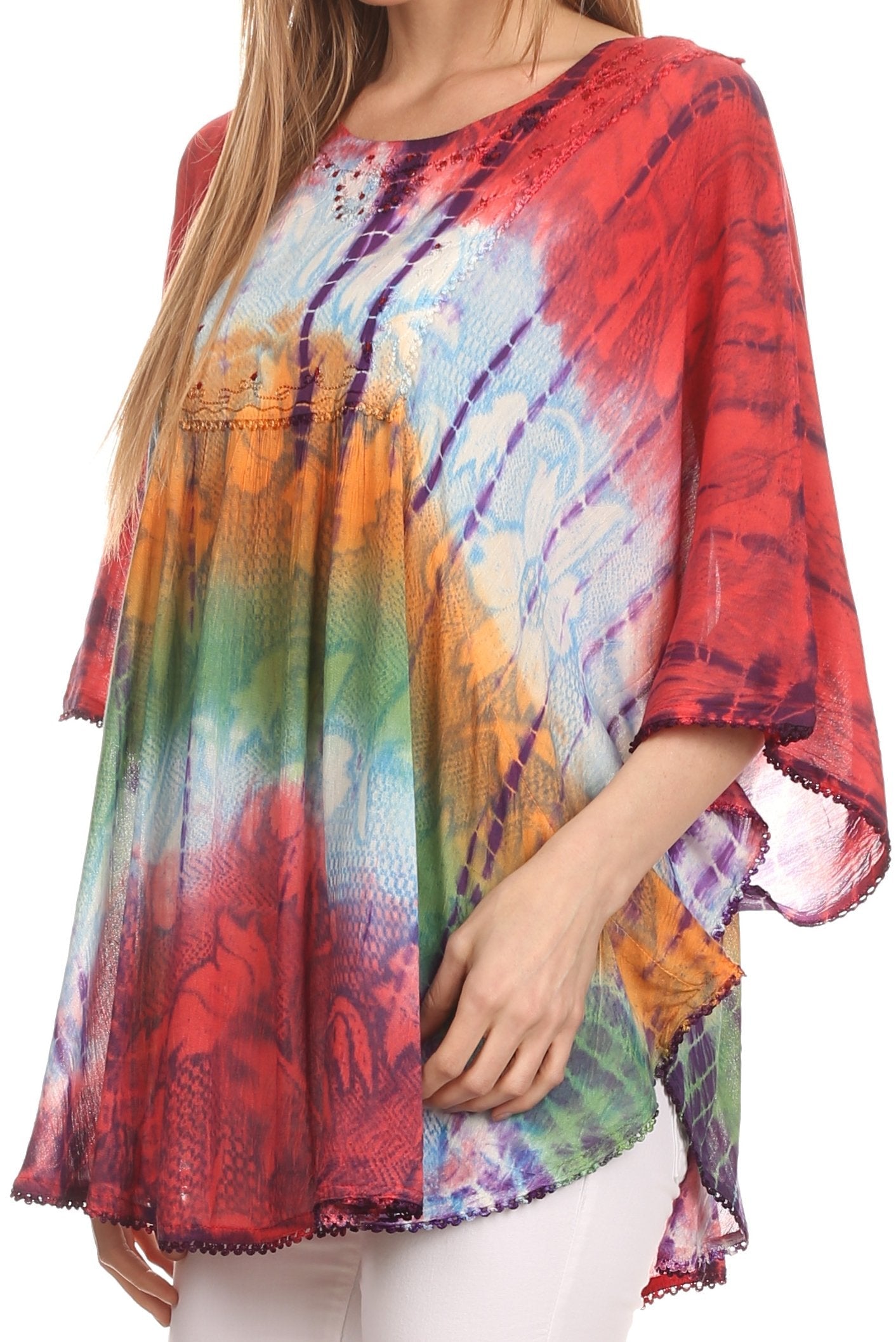 Multicolored tie-dye top worn by a person on a white background