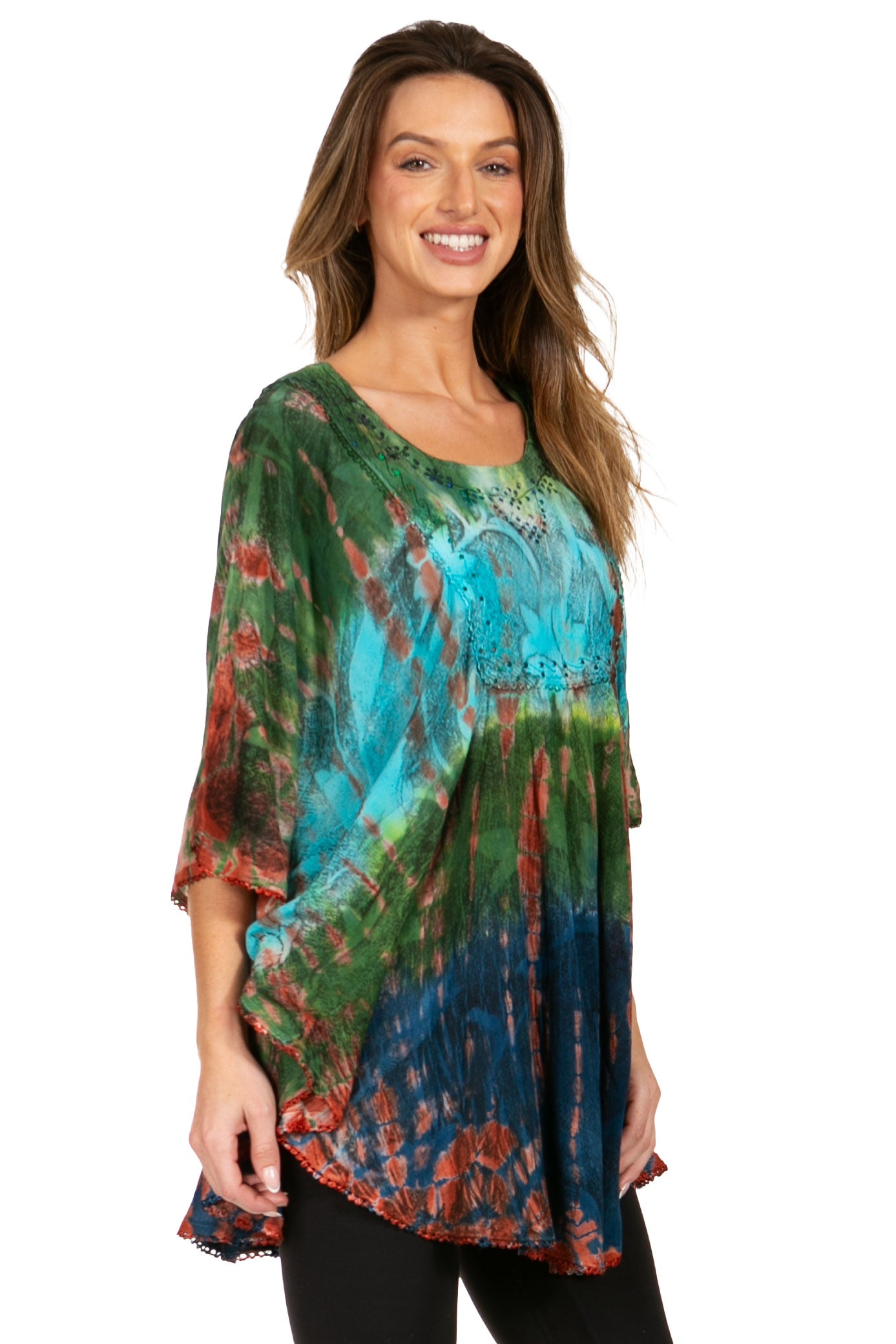 Woman wearing a colorful tie-dye shirt on a white background