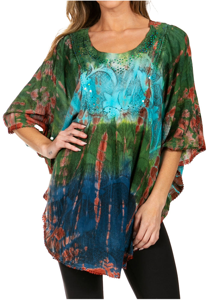 Woman wearing a colorful tie-dye shirt with a white background