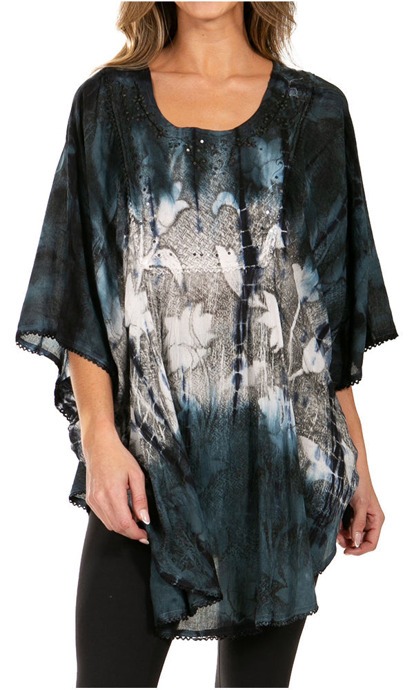 Woman wearing a black and blue tie-dye kimono-style top on a white background