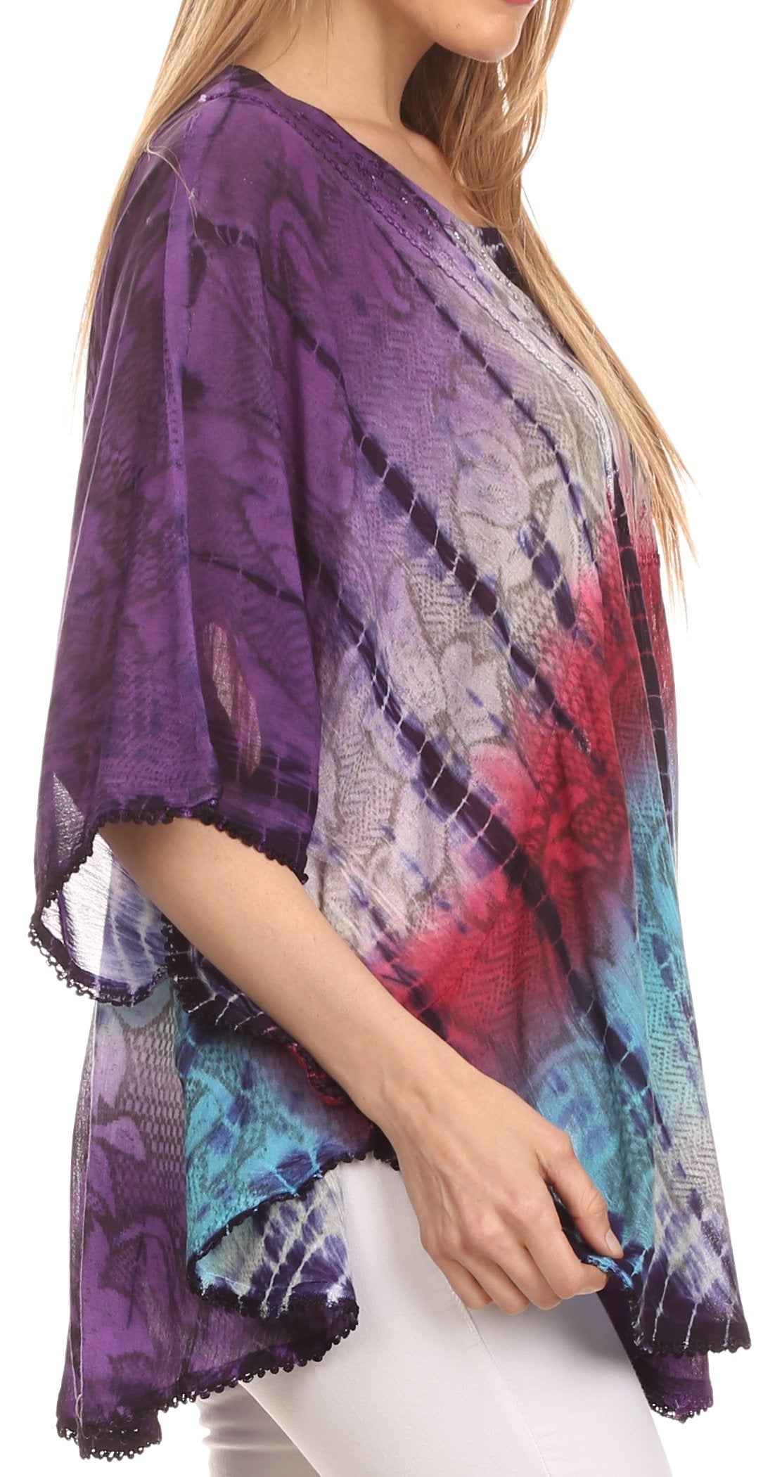 Woman wearing a colorful kimono-style garment with a tie-dye pattern on a white background
