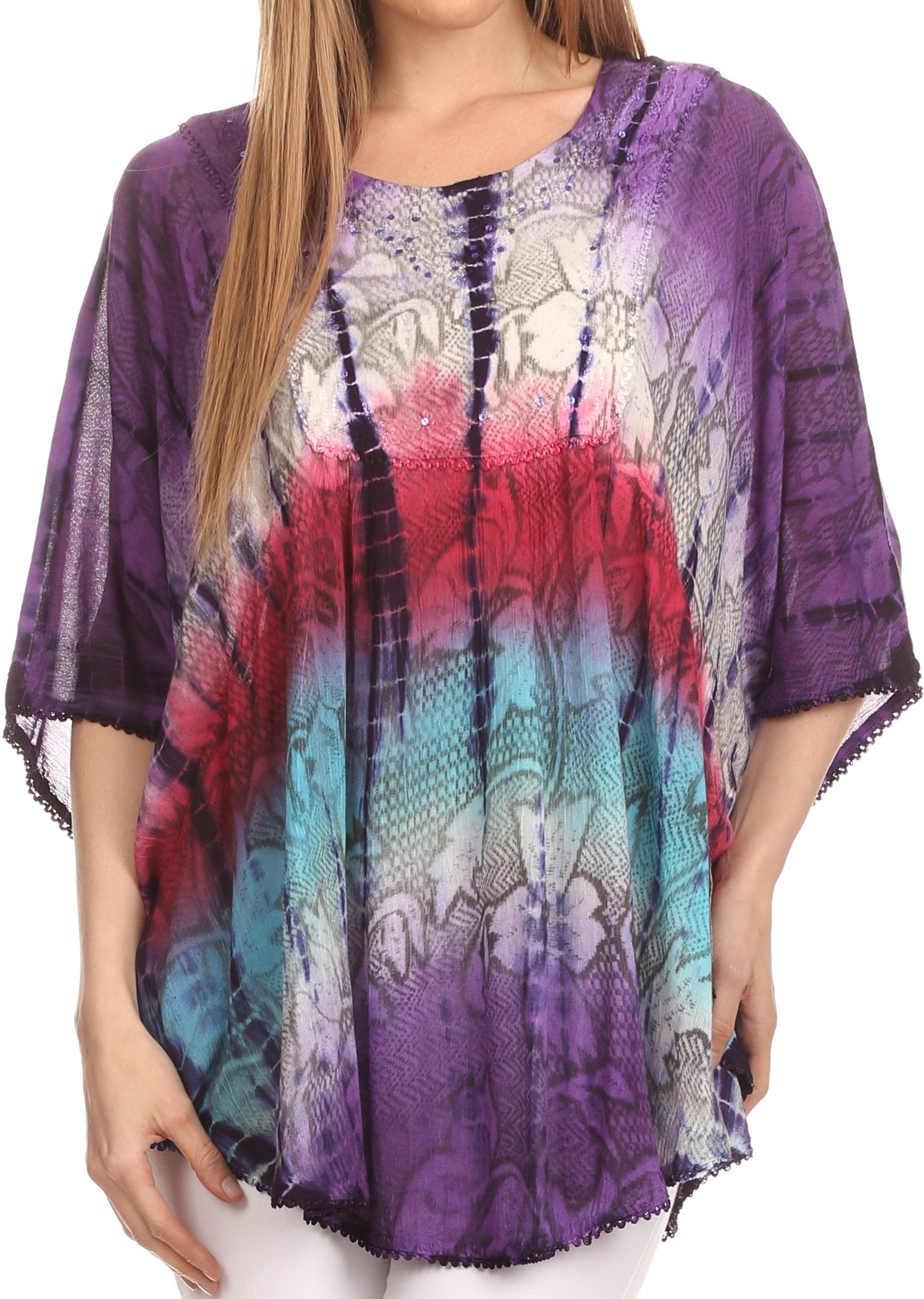 Multicolored patterned top worn by a person on a white background