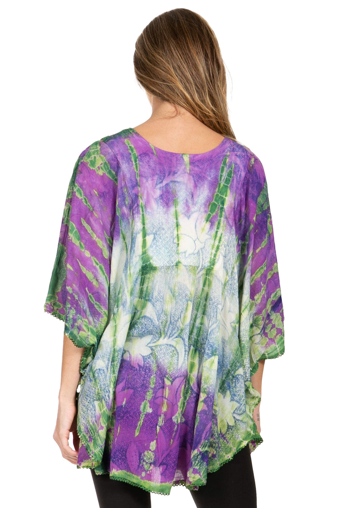 Woman wearing a colorful tie-dye kimono-style top on a white background