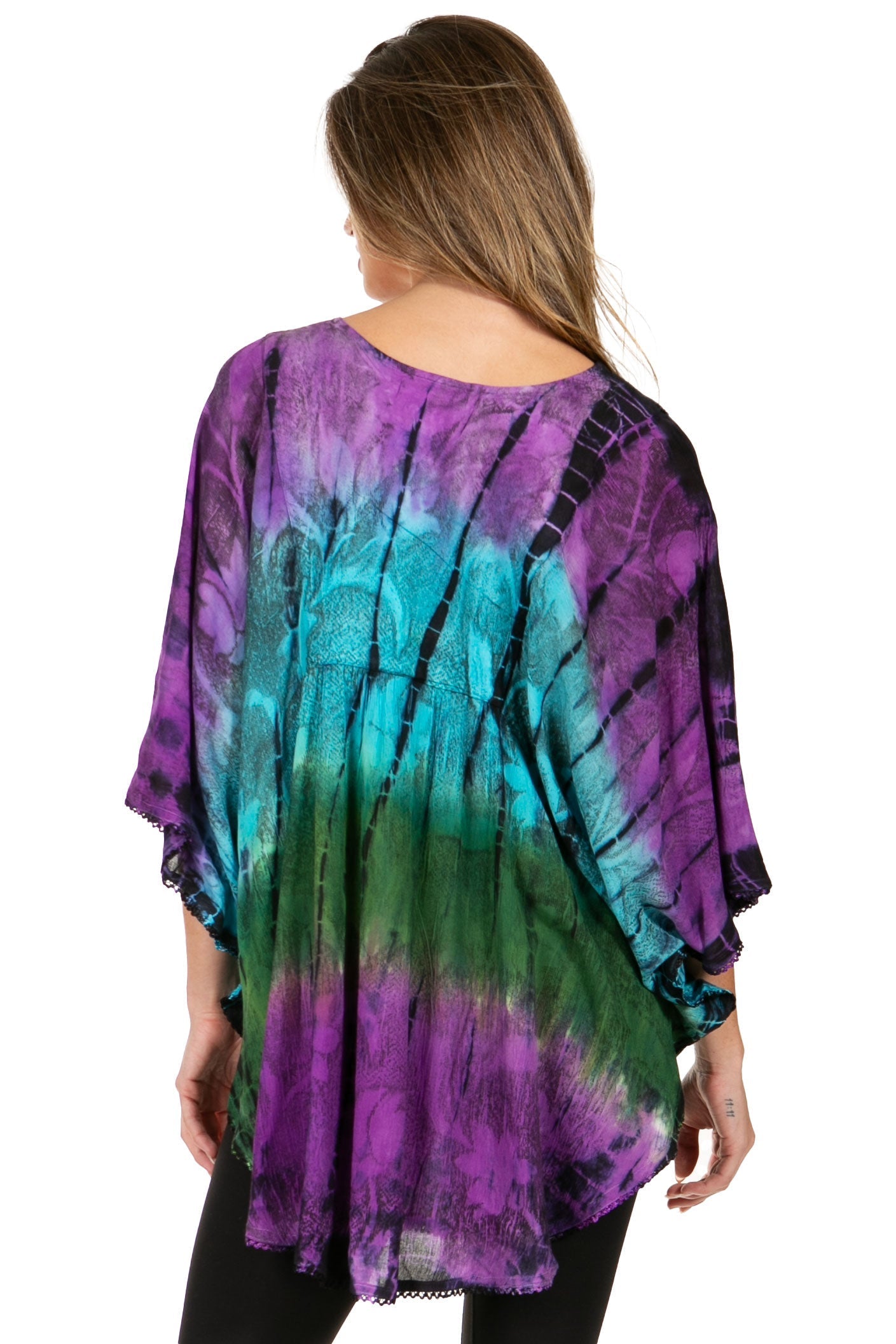 Woman wearing a tie-dye shirt with purple, green, and black colors on a white background
