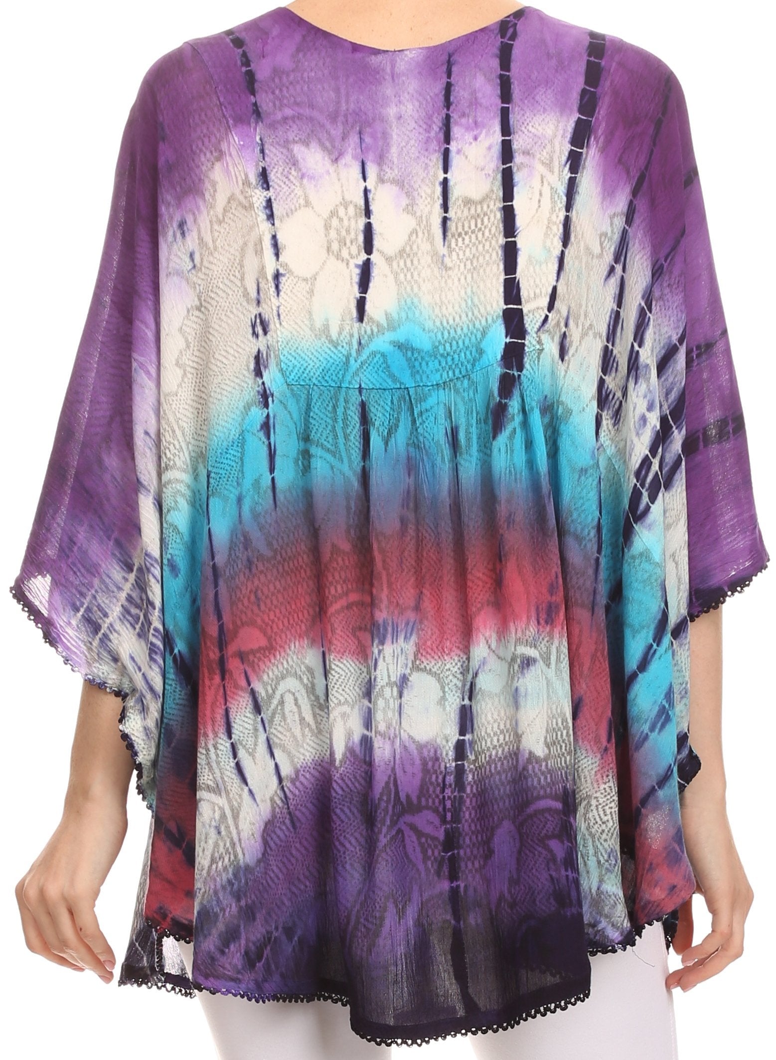 Multicolored tie-dye top worn by a person on a white background