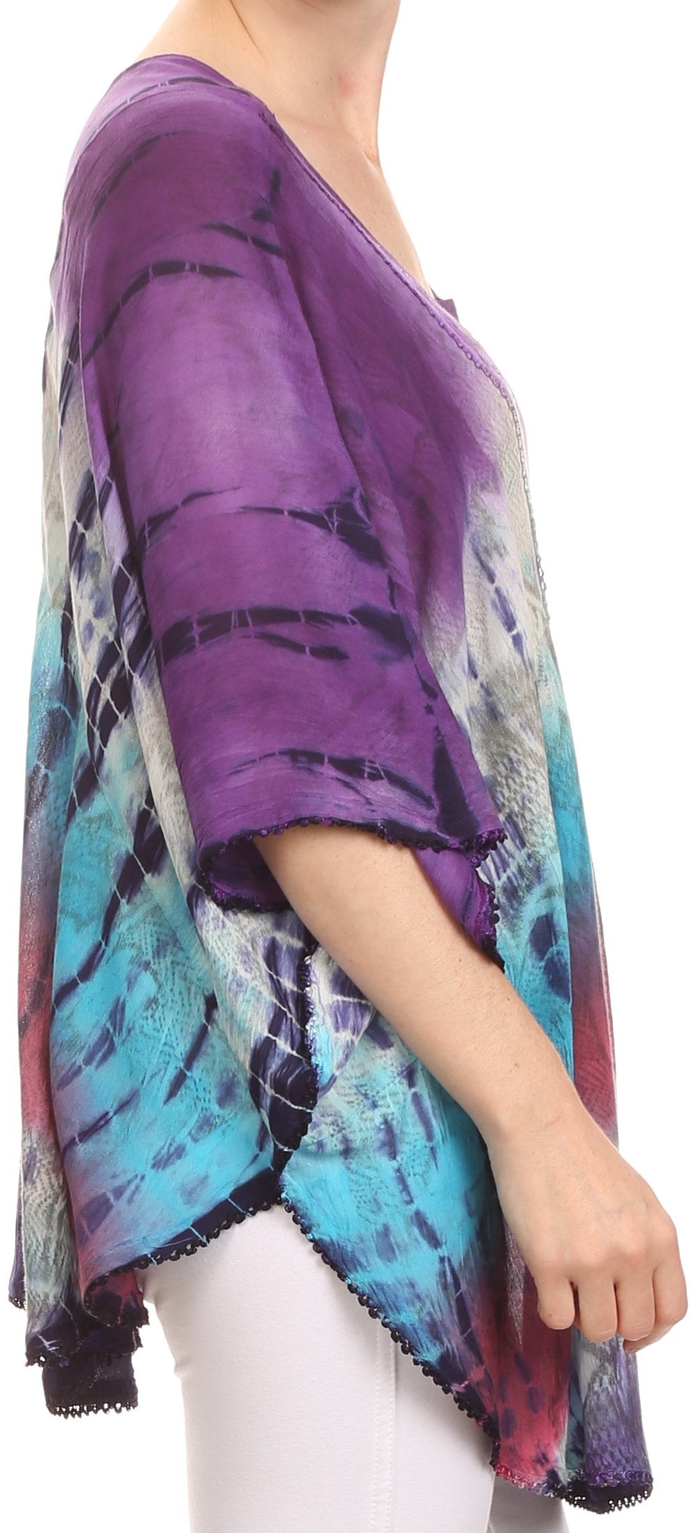 Person wearing a colorful tie-dye kimono over a white outfit