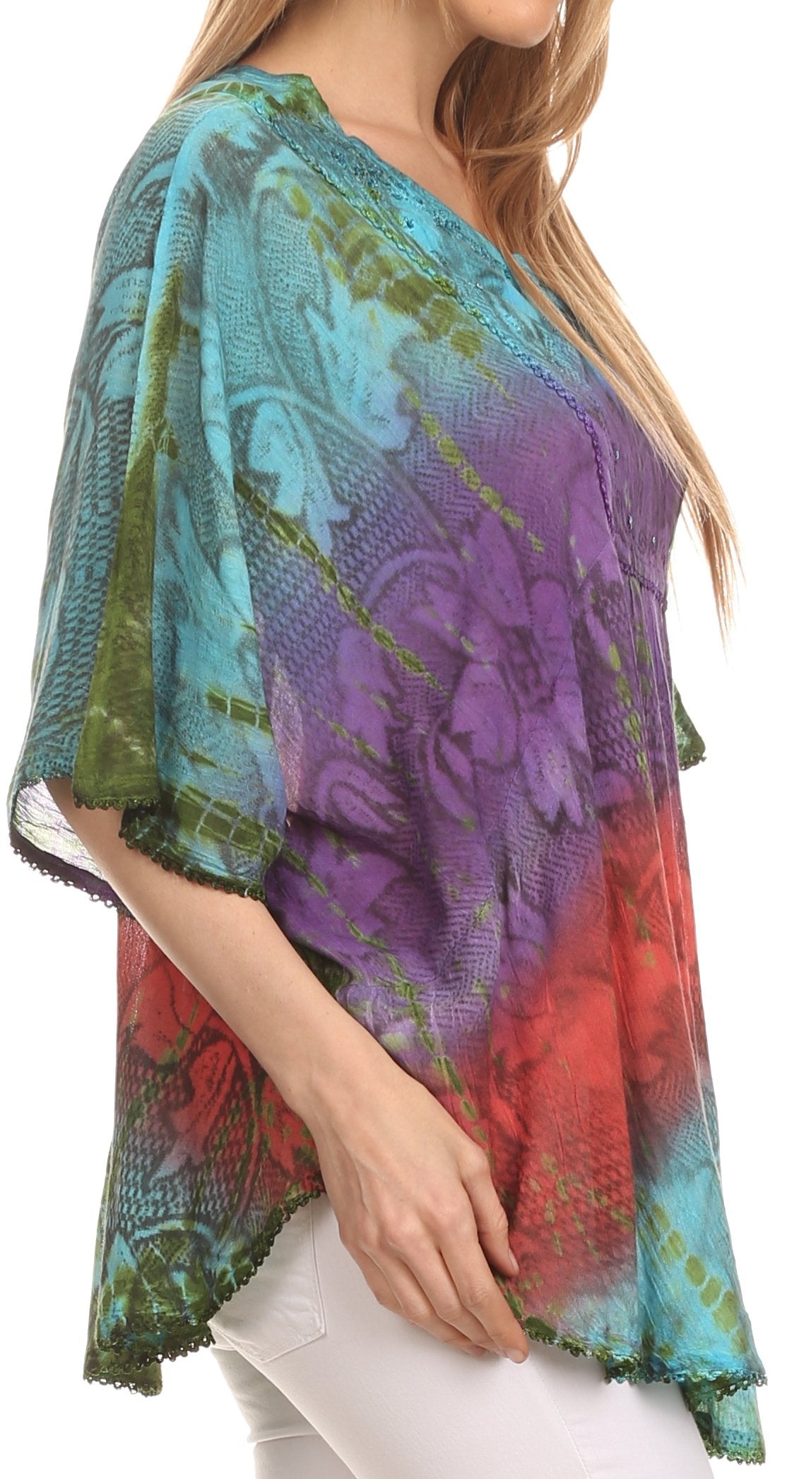 Colorful patterned shawl draped over a person on a white background