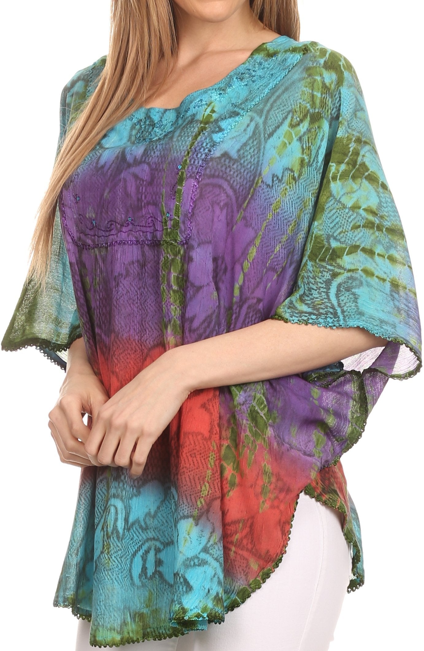 Colorful patterned top worn by a model on a white background