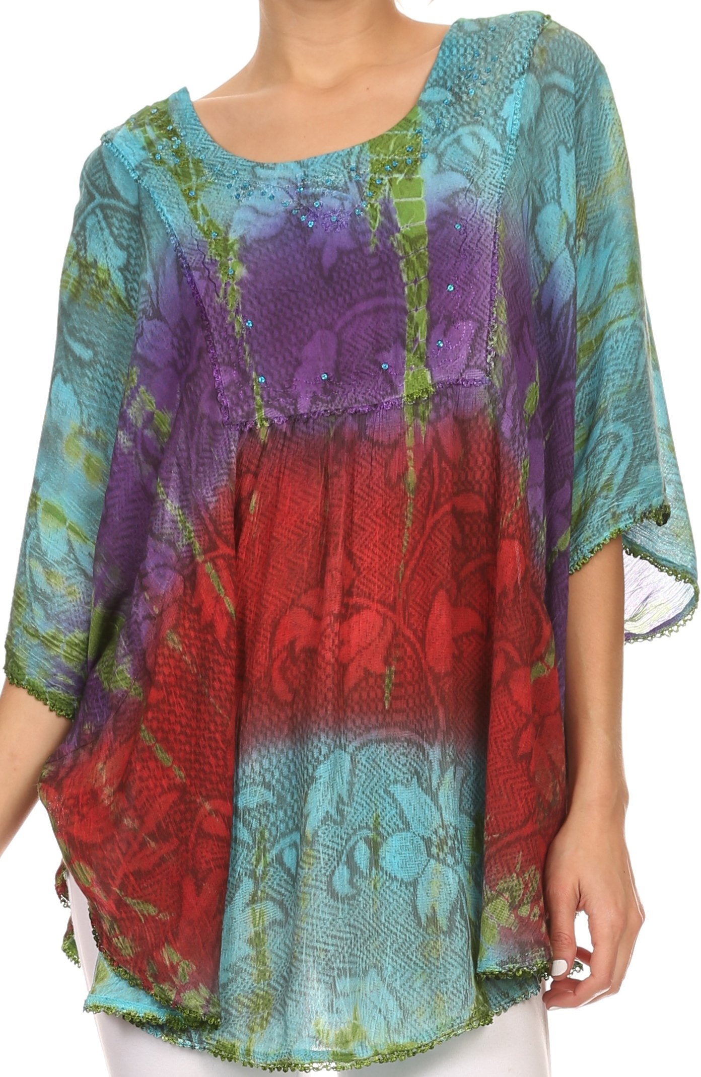 Colorful patterned top with a mix of red, purple, and blue on a plain background