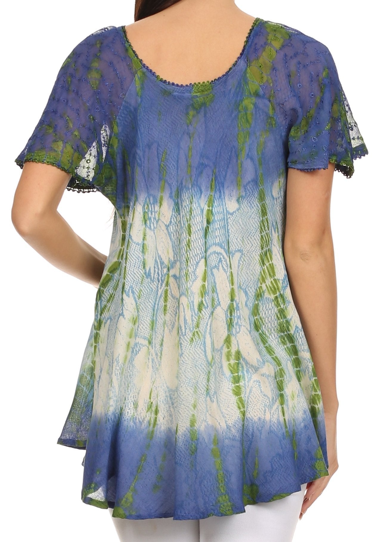 Woman wearing a blue and green patterned top on a white background