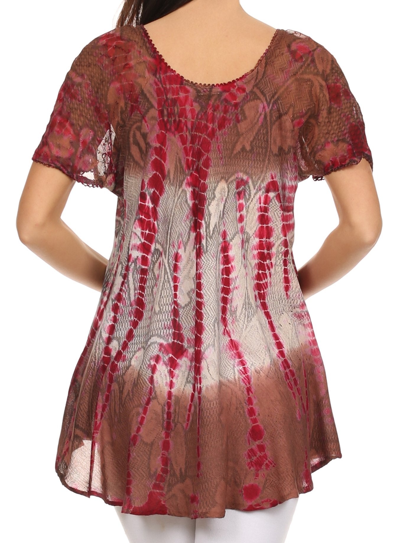 Sheer red and brown patterned top worn by a person on a white background