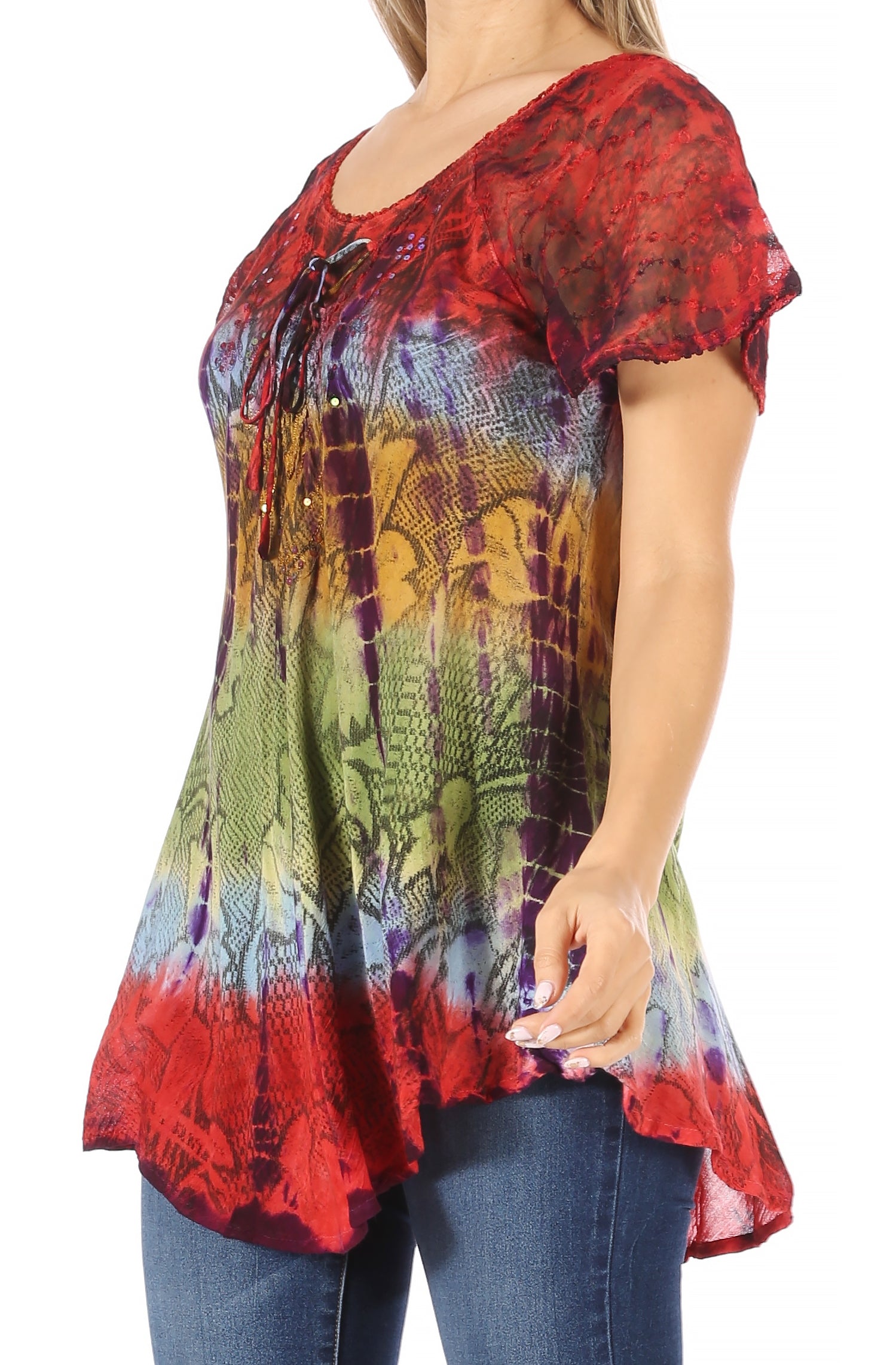 Multicolored tie-dye top worn by a person on a white background