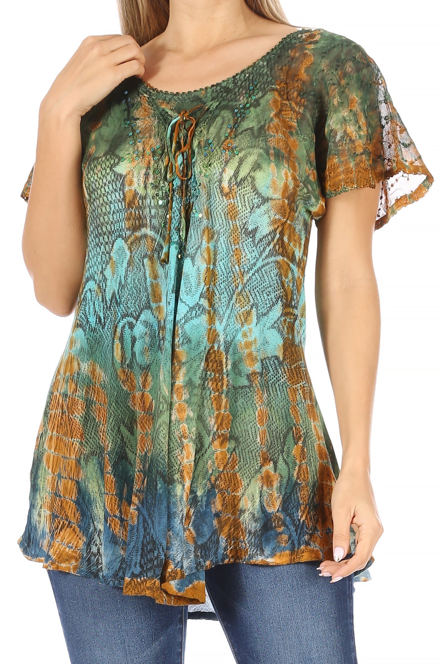 Woman wearing a patterned top with short sleeves and a drawstring neckline.