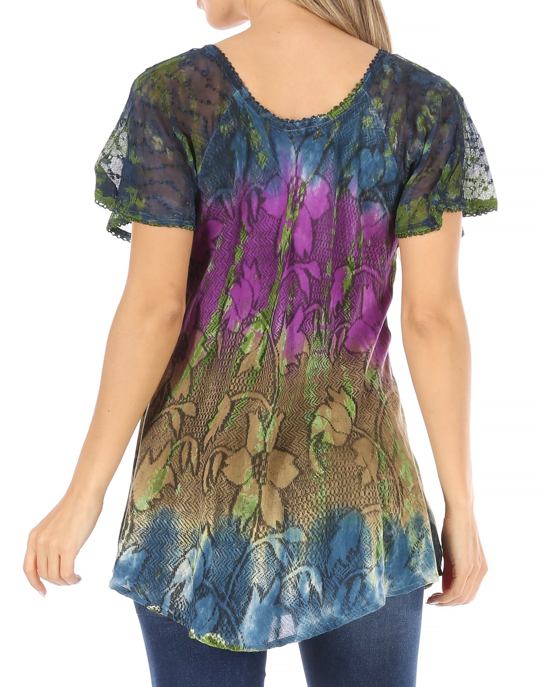 Woman wearing a colorful floral-patterned top on a white background
