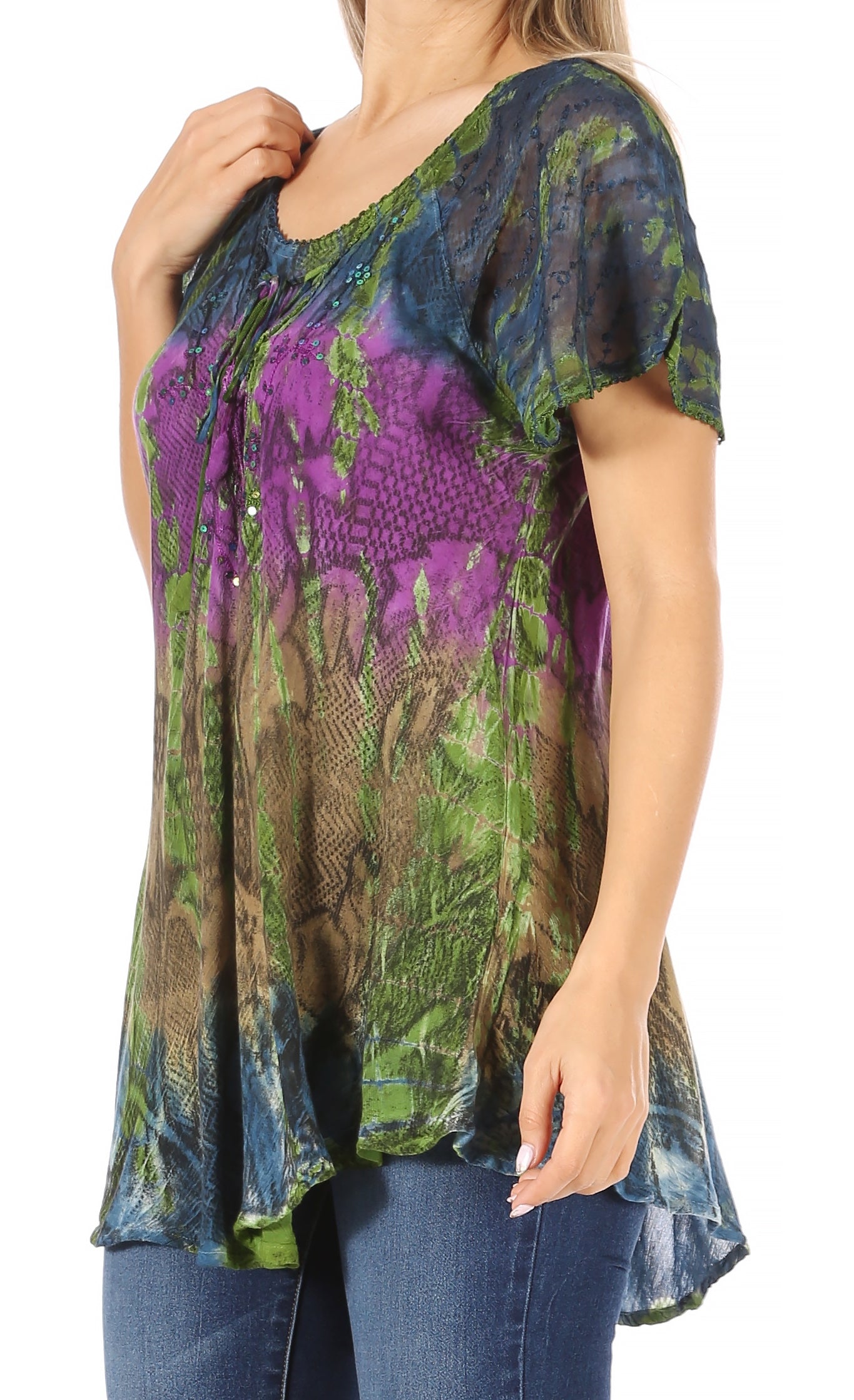 Woman wearing a colorful patterned top with short sleeves on a white background