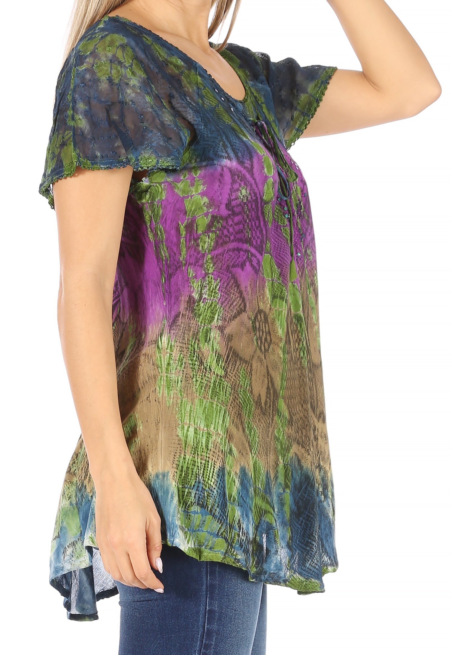 Multicolored patterned top worn by a person on a white background