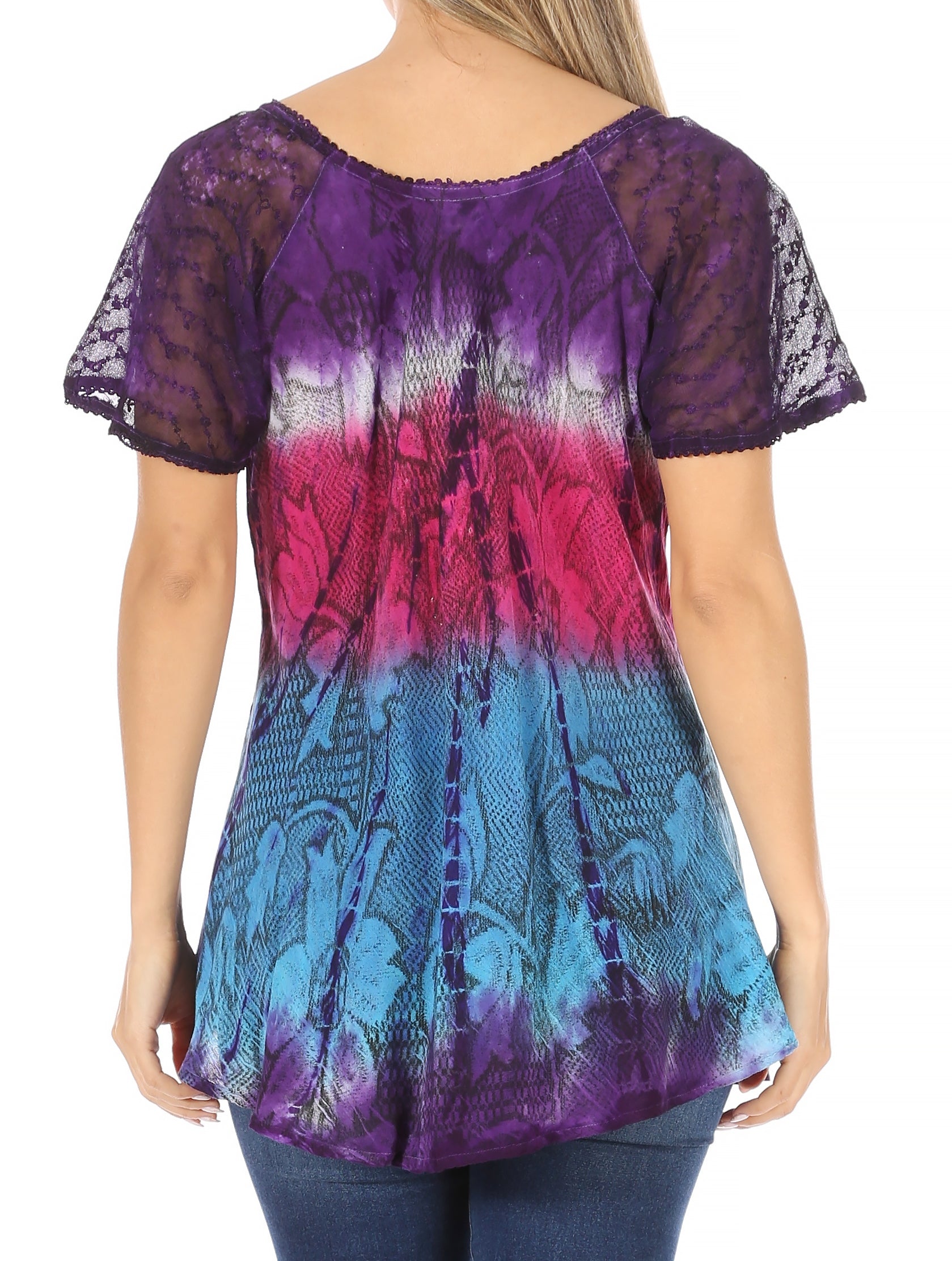 Woman wearing a colorful tie-dye shirt with a gradient from purple to pink to blue.