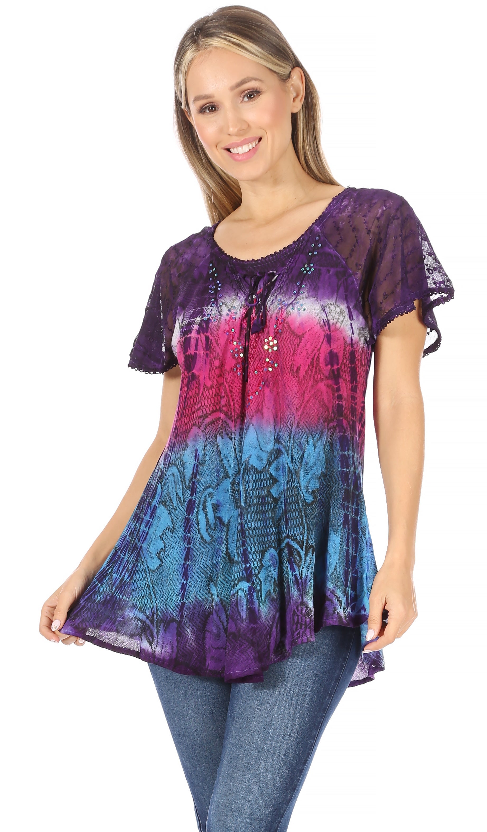 Woman wearing a colorful tie-dye shirt with a white background