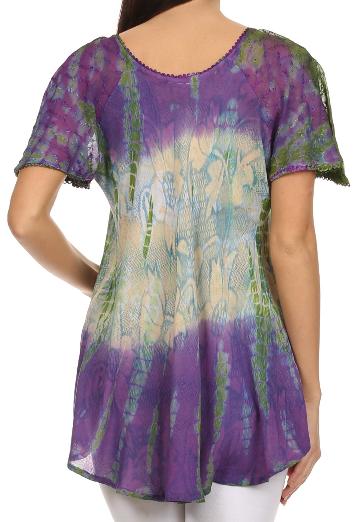 Woman wearing a colorful tie-dye shirt with a white background
