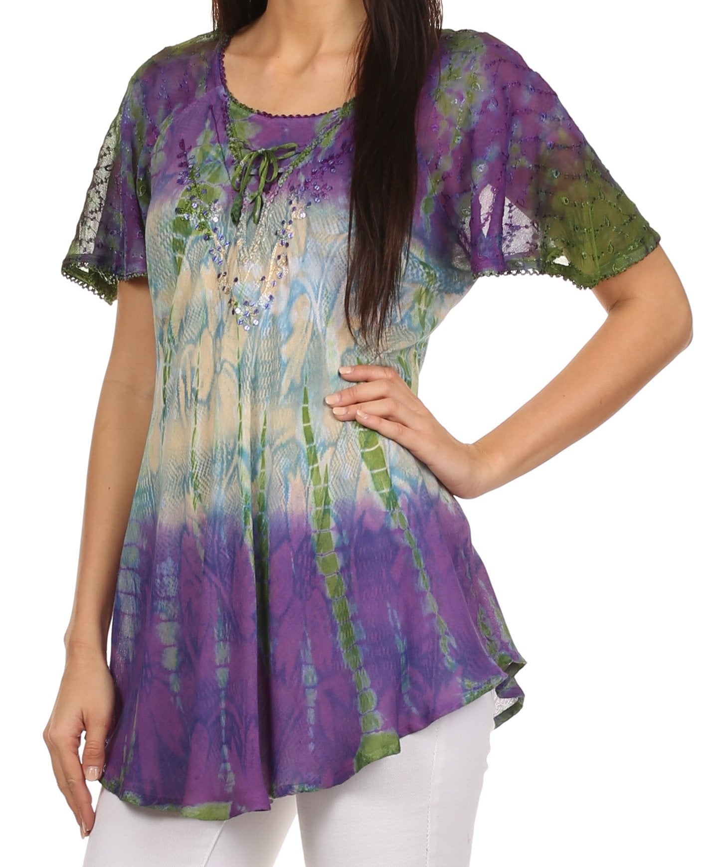 Woman wearing a colorful tie-dye shirt with a white background