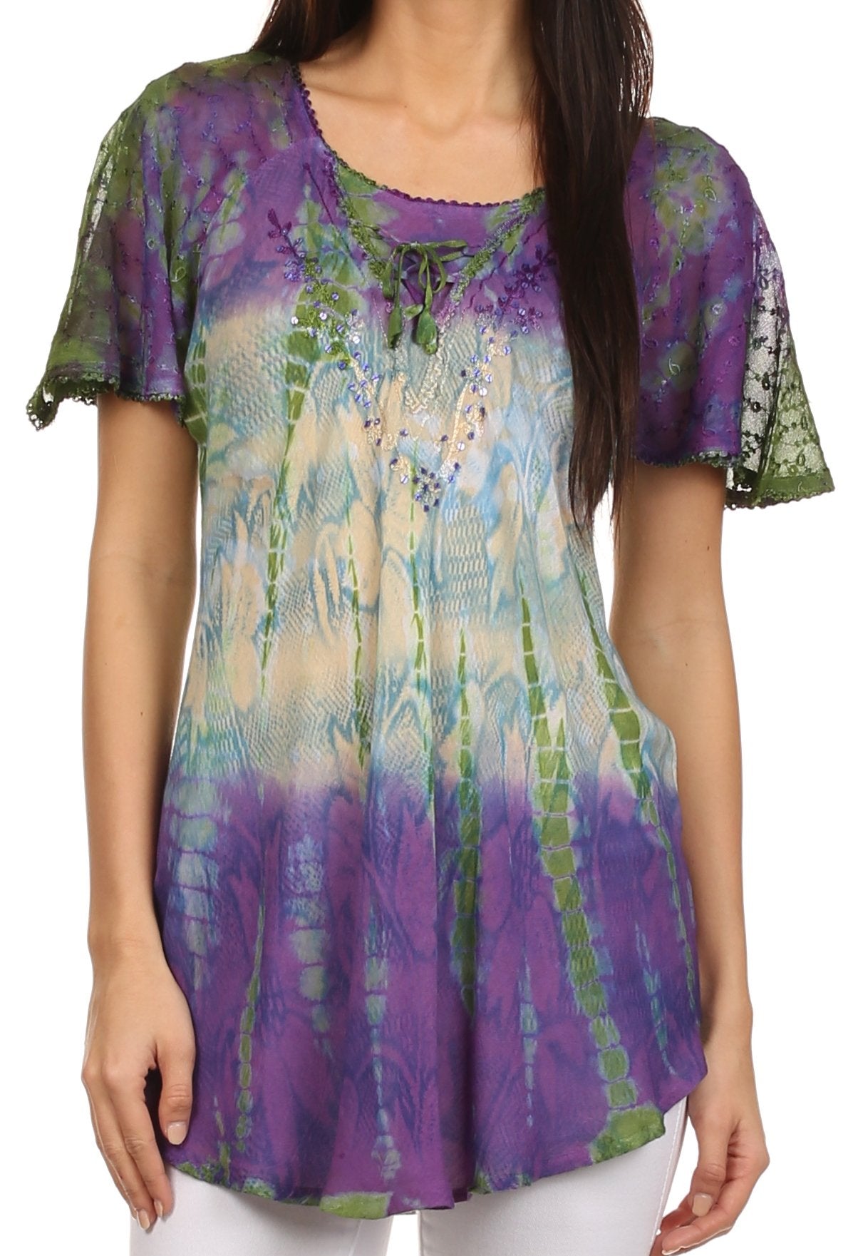Woman wearing a colorful tie-dye shirt with short sleeves.