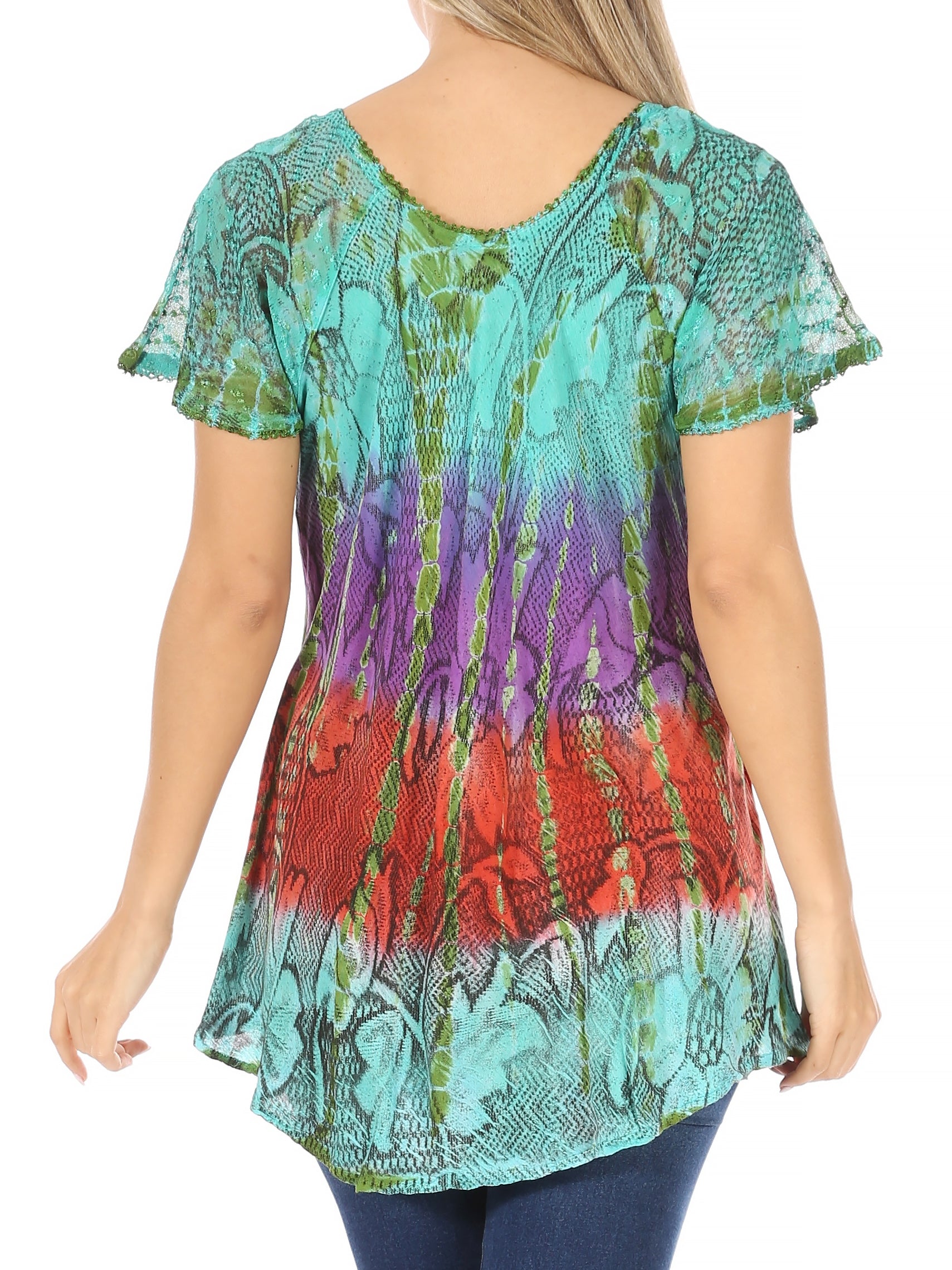 Woman wearing a colorful patterned top on a white background